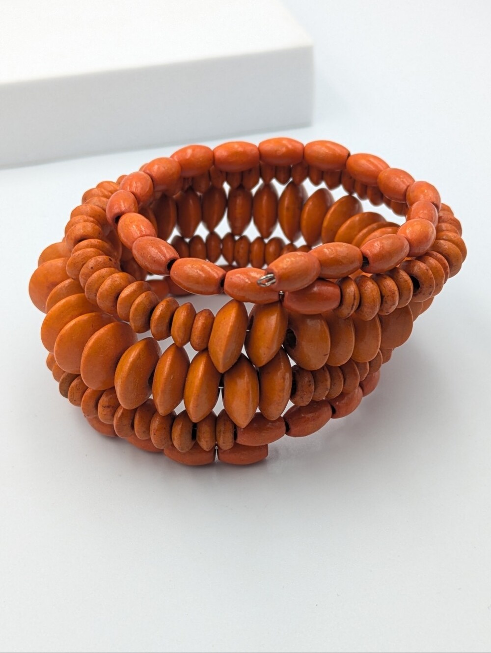 Orange painted wood beaded wire wrap bracelet
